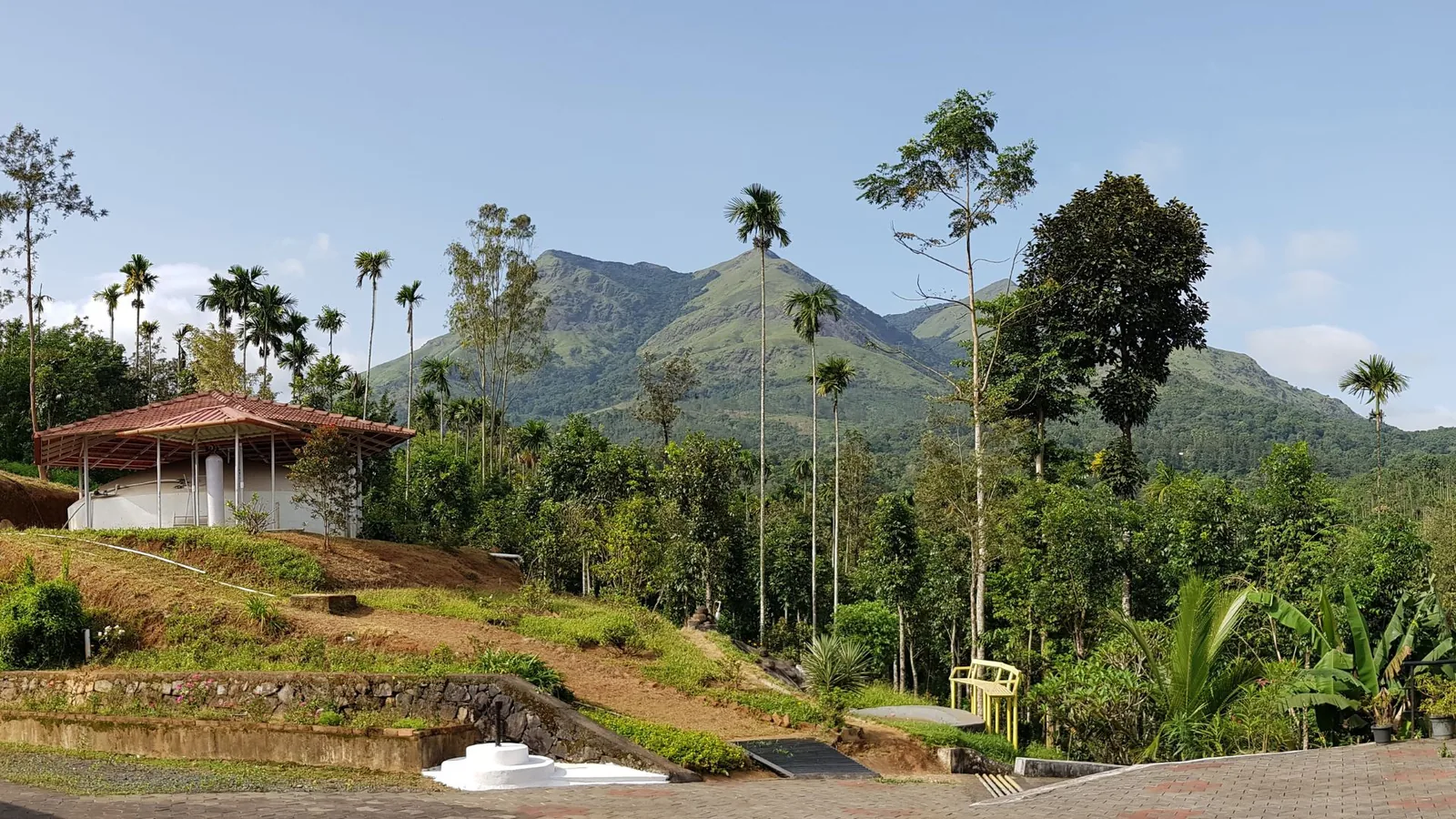 Ananda Matha monastery garden beneath the mountains of Kerala